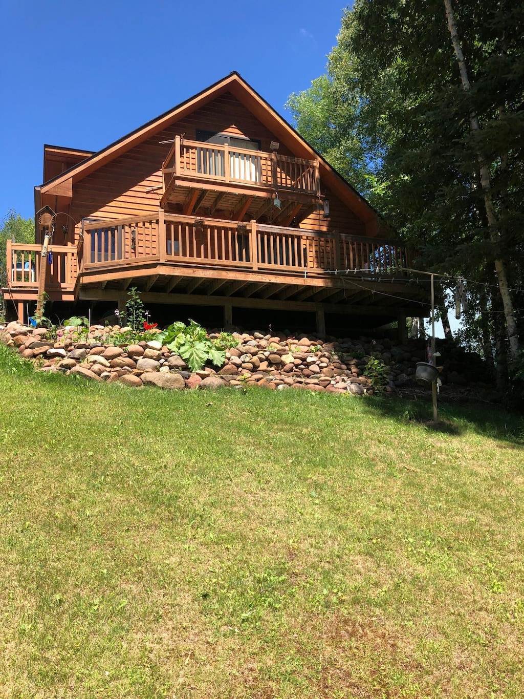 3634 Oak Ln, Barnum Twp, MN 55707 - back of house featuring a wooden deck and a lawn