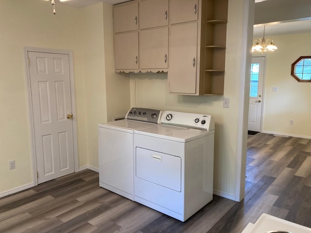 643 Miller Ave, Windom, MN 56101 - laundry room featuring washing machine and clothes dryer, dark wood finished floors, cabinet space, and a chandelier