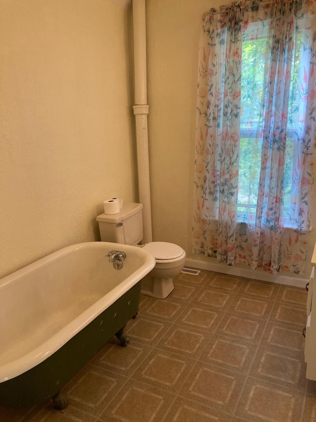 643 Miller Ave, Windom, MN 56101 - full bath with a freestanding tub, toilet, and tile patterned floors