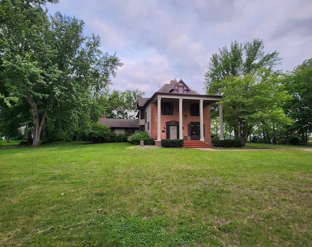 1315 Fairview Ave, Olivia, MN 56277 - view of front of house with a front lawn and brick siding
