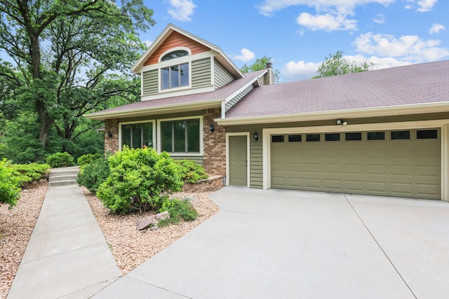 11960 Albavar Path, Inver Grove Heights, MN 55077 - view of front of house with a garage, concrete driveway, brick siding, and a chimney