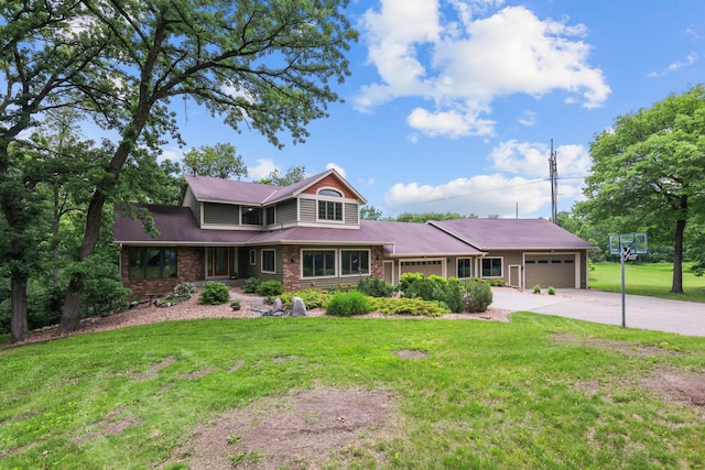 11960 Albavar Path, Inver Grove Heights, MN 55077 - view of front of home with an attached garage, concrete driveway, and a front lawn