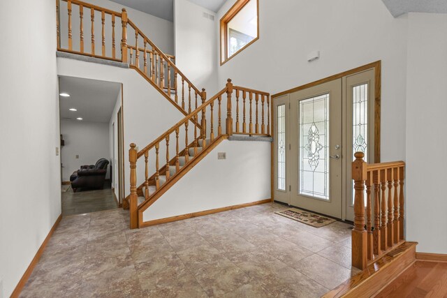 11960 Albavar Path, Inver Grove Heights, MN 55077 - foyer with a towering ceiling, healthy amount of natural light, baseboards, and stairway