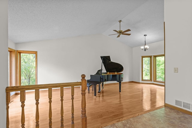 11960 Albavar Path, Inver Grove Heights, MN 55077 - sitting room featuring vaulted ceiling, healthy amount of natural light, ceiling fan, wood finished floors, and a chandelier