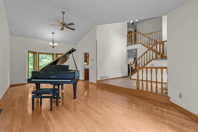 11960 Albavar Path, Inver Grove Heights, MN 55077 - sitting room with a chandelier, wood finished floors, a ceiling fan, stairway, and baseboards