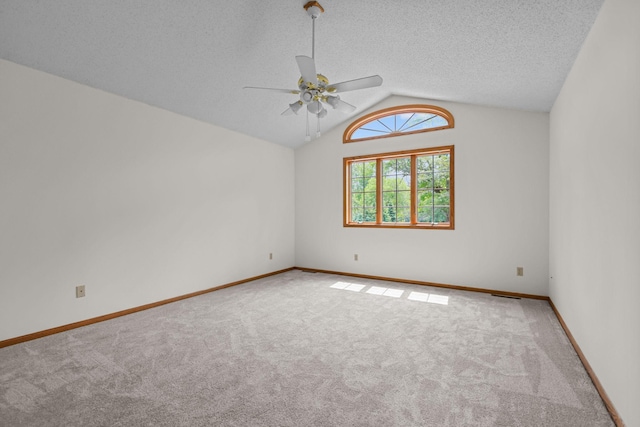 11960 Albavar Path, Inver Grove Heights, MN 55077 - carpeted empty room featuring ceiling fan, lofted ceiling, a textured ceiling, and baseboards