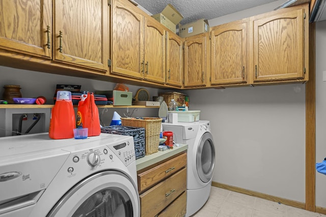 11960 Albavar Path, Inver Grove Heights, MN 55077 - laundry room with washing machine and clothes dryer, cabinet space, a textured ceiling, baseboards, and light tile patterned floors