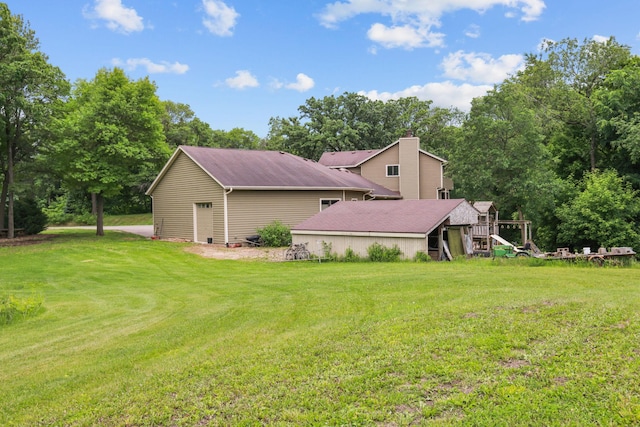 11960 Albavar Path, Inver Grove Heights, MN 55077 - view of home's exterior featuring a yard, a chimney, an outbuilding, and view of scattered trees