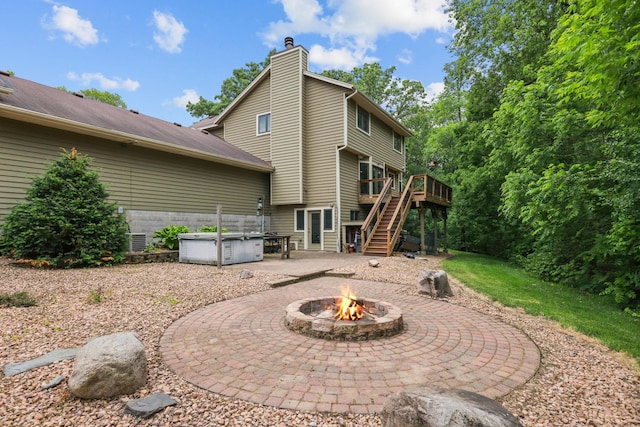 11960 Albavar Path, Inver Grove Heights, MN 55077 - rear view of house featuring a hot tub, a fire pit, stairs, a patio, and a wooden deck