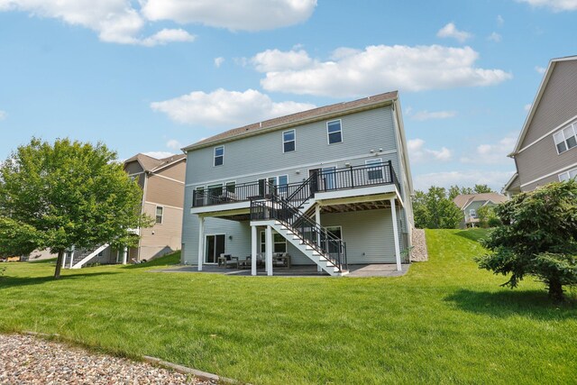 18482 Aubrie Ct, Eden Prairie, MN 55347 - rear view of property featuring stairway, a patio, a deck, and a lawn