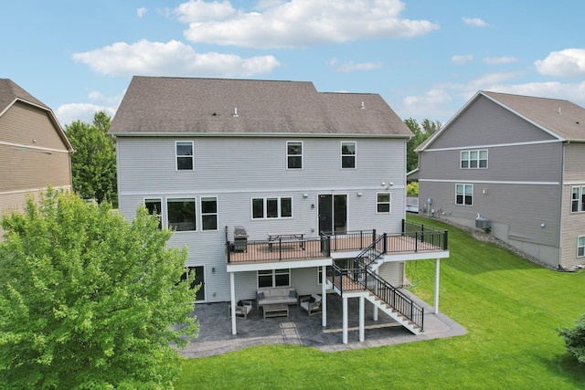 18482 Aubrie Ct, Eden Prairie, MN 55347 - back of house with stairway, a patio area, a wooden deck, a yard, and an outdoor living space