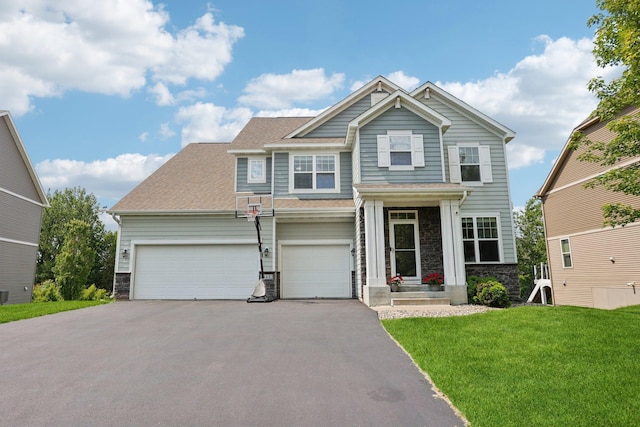 18482 Aubrie Ct, Eden Prairie, MN 55347 - craftsman-style home with stone siding, asphalt driveway, a front lawn, a shingled roof, and a garage