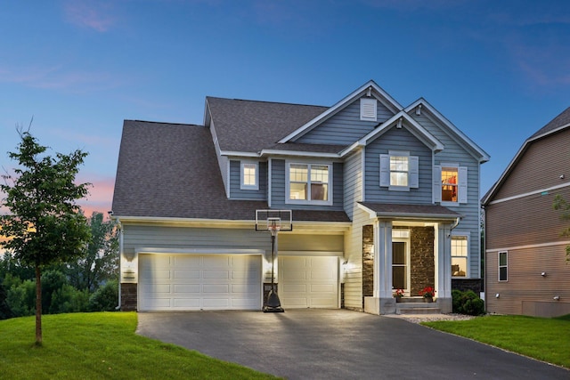 18482 Aubrie Ct, Eden Prairie, MN 55347 - craftsman-style home featuring stone siding, asphalt driveway, roof with shingles, a lawn, and an attached garage