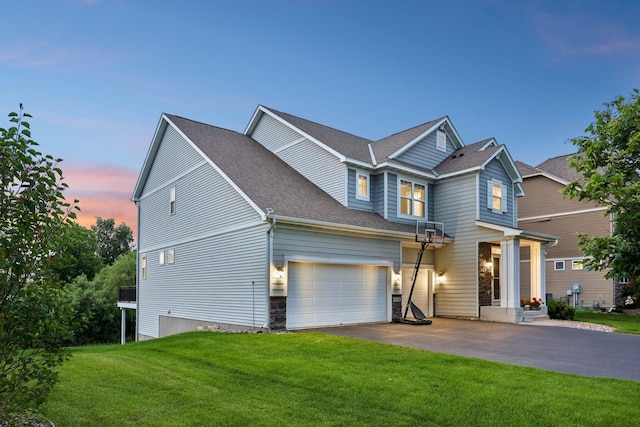 18482 Aubrie Ct, Eden Prairie, MN 55347 - view of front facade with asphalt driveway, a lawn, roof with shingles, and stone siding