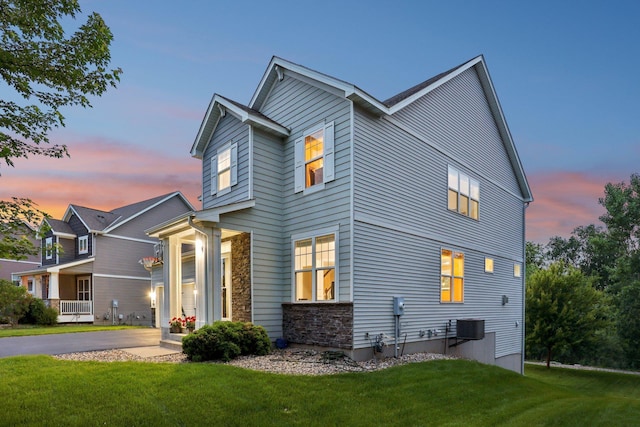 18482 Aubrie Ct, Eden Prairie, MN 55347 - view of front of house featuring stone siding and a yard