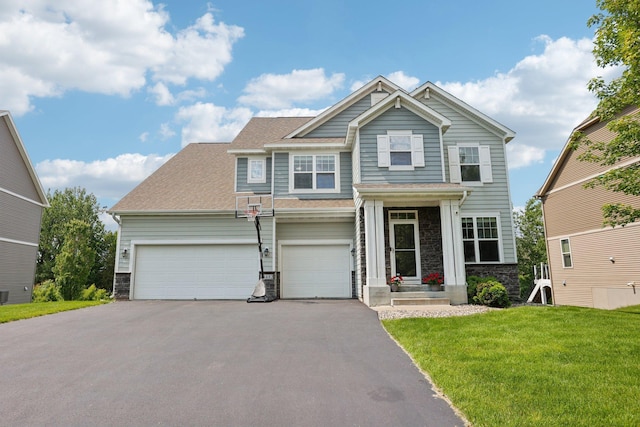 18482 Aubrie Ct, Eden Prairie, MN 55347 - craftsman-style home with stone siding, driveway, a front lawn, and roof with shingles