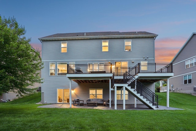 18482 Aubrie Ct, Eden Prairie, MN 55347 - back of property at dusk with outdoor lounge area, a patio area, stairs, a deck, and a yard