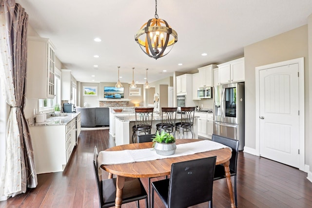 18482 Aubrie Ct, Eden Prairie, MN 55347 - dining area featuring a chandelier, dark wood-type flooring, and recessed lighting