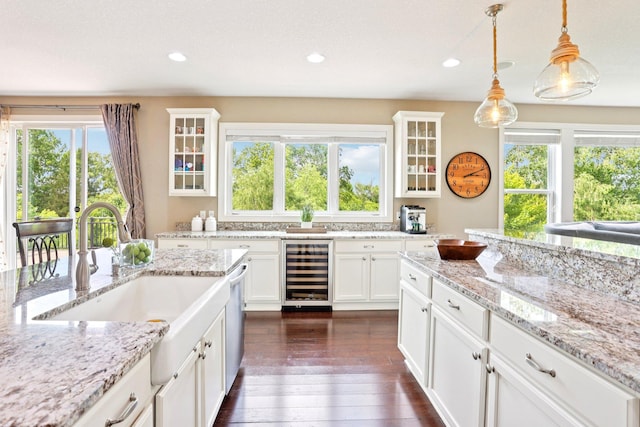 18482 Aubrie Ct, Eden Prairie, MN 55347 - kitchen featuring wine cooler, white cabinets, dark wood-style floors, hanging light fixtures, and recessed lighting