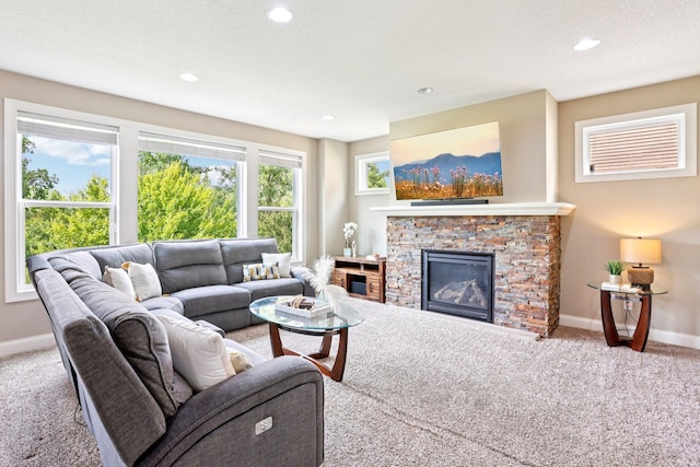 18482 Aubrie Ct, Eden Prairie, MN 55347 - carpeted living area featuring a fireplace and recessed lighting