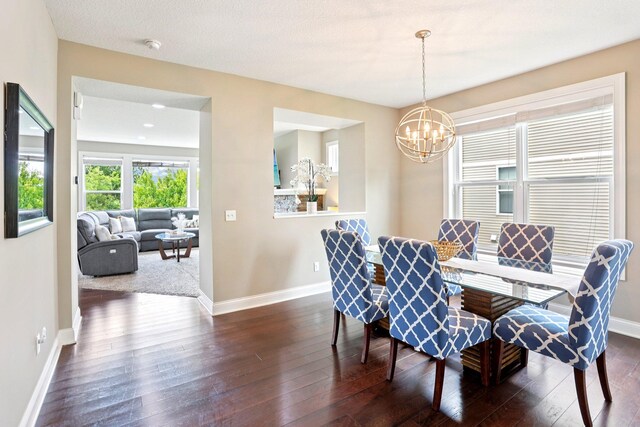 18482 Aubrie Ct, Eden Prairie, MN 55347 - dining area with a chandelier and dark wood finished floors