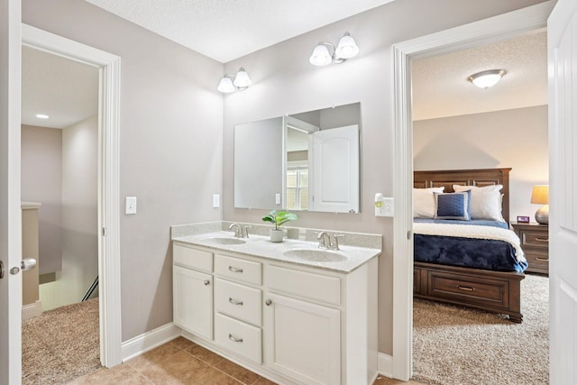 18482 Aubrie Ct, Eden Prairie, MN 55347 - ensuite bathroom featuring double vanity and tile patterned floors