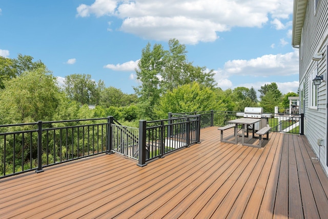 18482 Aubrie Ct, Eden Prairie, MN 55347 - wooden terrace featuring grilling area, outdoor dining space, and view of scattered trees