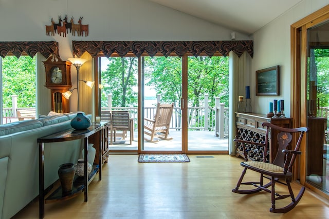27488 Ridgewood Dr, Merrifield, MN 56465 - living room with vaulted ceiling and hardwood / wood-style floors