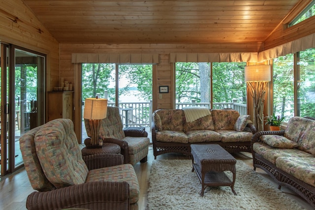 27488 Ridgewood Dr, Merrifield, MN 56465 - living area with vaulted ceiling, wooden walls, wood ceiling, and wood finished floors