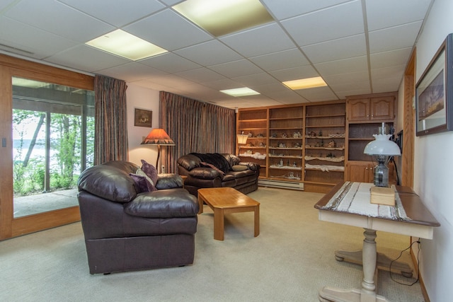 27488 Ridgewood Dr, Merrifield, MN 56465 - living room featuring a baseboard heating unit, carpet floors, built in features, and a drop ceiling