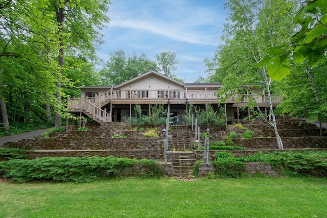 27488 Ridgewood Dr, Merrifield, MN 56465 - rear view of property with stairway, a wooden deck, and a lawn