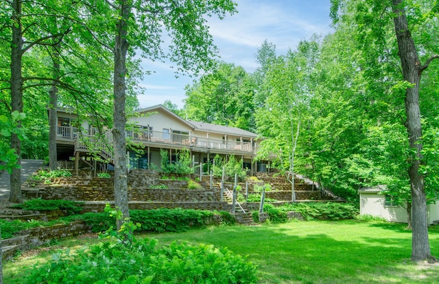 27488 Ridgewood Dr, Merrifield, MN 56465 - back of house featuring stairs, a deck, a lawn, and an outbuilding