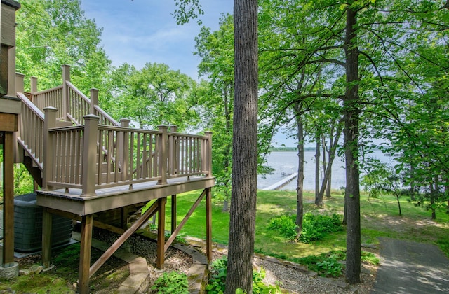 27488 Ridgewood Dr, Merrifield, MN 56465 - view of yard featuring stairway, a deck with water view, and central air condition unit