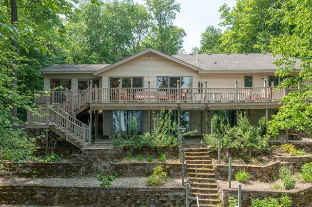 27488 Ridgewood Dr, Merrifield, MN 56465 - rear view of house with stairway, a deck, and a shingled roof