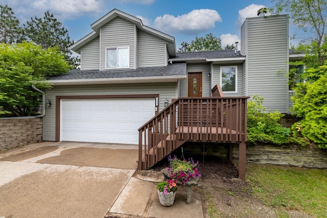 360 117th Ave NW, Coon Rapids, MN 55448 - view of front of home with an attached garage, driveway, roof with shingles, and a chimney