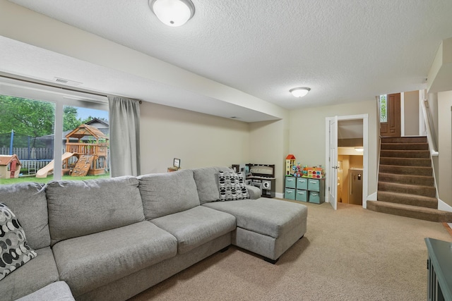 360 117th Ave NW, Coon Rapids, MN 55448 - living area with stairway, a textured ceiling, and light carpet