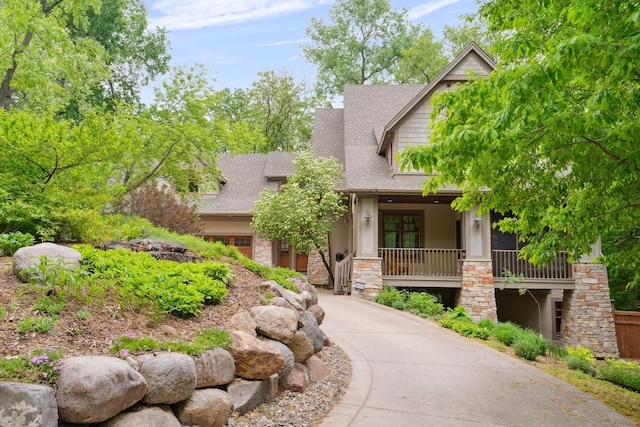 1501 June Ave S, Golden Valley, MN 55416 - craftsman inspired home featuring stone siding, a shingled roof, a porch, and stucco siding