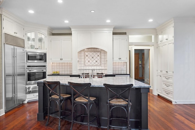 1501 June Ave S, Golden Valley, MN 55416 - kitchen with built in appliances, a warming drawer, dark wood-style flooring, light stone countertops, and recessed lighting