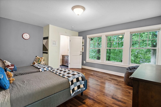 1501 June Ave S, Golden Valley, MN 55416 - bedroom featuring dark wood-style floors and a textured ceiling