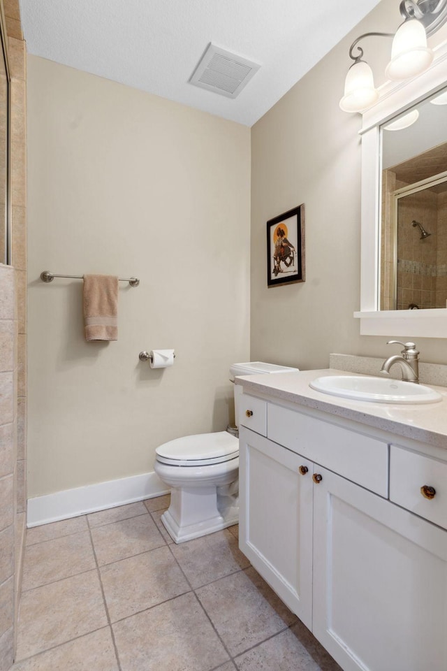 1501 June Ave S, Golden Valley, MN 55416 - bathroom featuring vanity, tiled shower, and tile patterned flooring