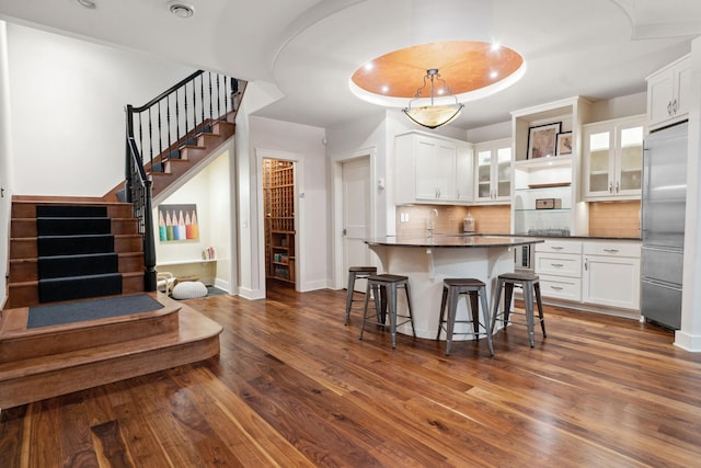 1501 June Ave S, Golden Valley, MN 55416 - kitchen featuring high end fridge, dark countertops, and white cabinets