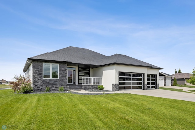 3004 6th St E, West Fargo, ND 58078 - prairie-style house with stone siding, an attached garage, and a front yard