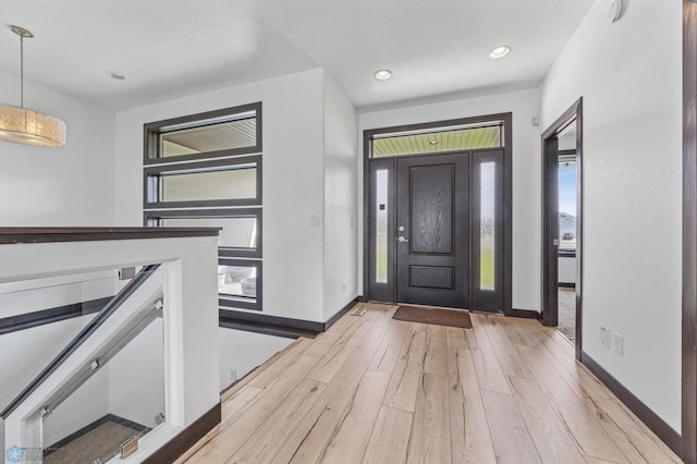 3004 6th St E, West Fargo, ND 58078 - entryway with baseboards, light wood-style floors, and recessed lighting