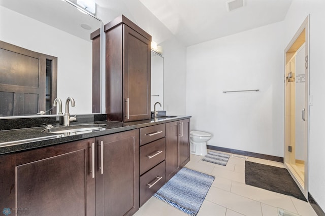 3004 6th St E, West Fargo, ND 58078 - full bath featuring double vanity, a shower stall, toilet, and baseboards