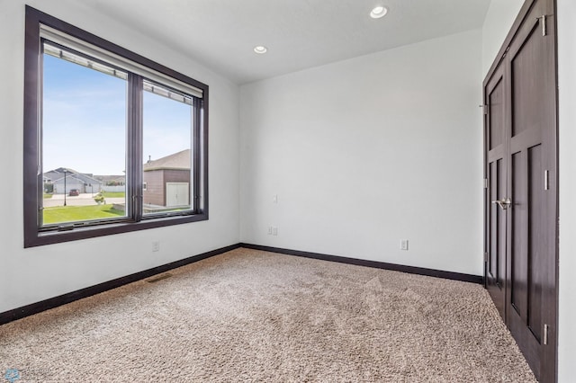3004 6th St E, West Fargo, ND 58078 - carpeted empty room featuring baseboards and recessed lighting