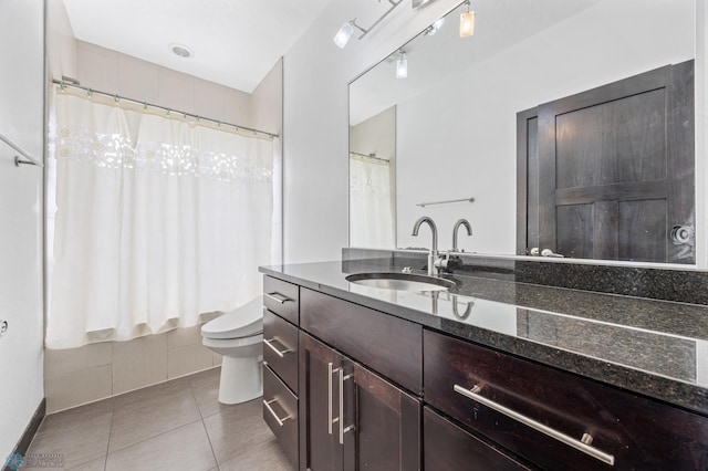 3004 6th St E, West Fargo, ND 58078 - bathroom featuring tile patterned flooring, vanity, toilet, and curtained shower