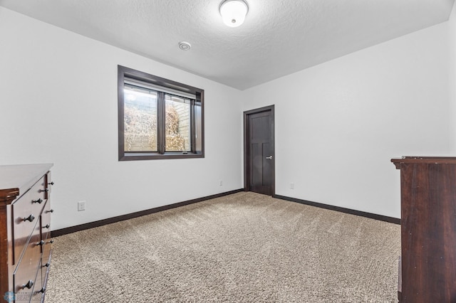 3004 6th St E, West Fargo, ND 58078 - carpeted empty room with a textured ceiling and baseboards