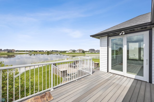3004 6th St E, West Fargo, ND 58078 - wooden deck featuring a water view and a lawn