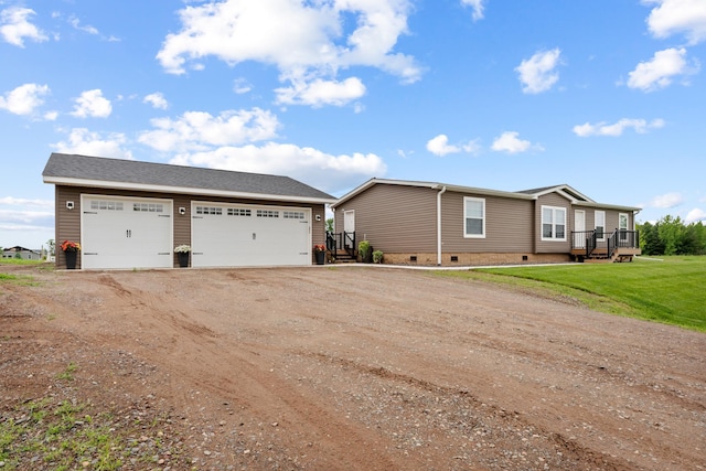 16536 Hook Cir, Pokegama Twp, MN 55030 - view of front facade with crawl space, dirt driveway, an outbuilding, a detached garage, and a front yard