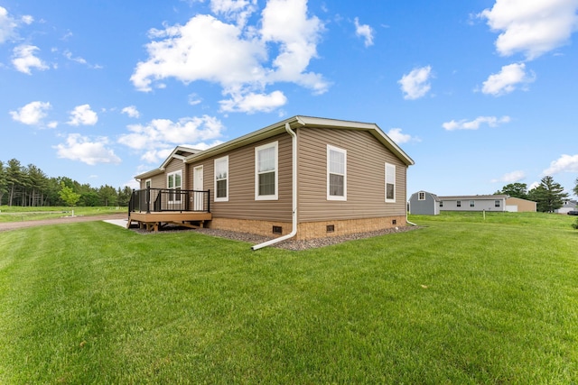 16536 Hook Cir, Pokegama Twp, MN 55030 - view of property exterior with crawl space, a deck, and a lawn